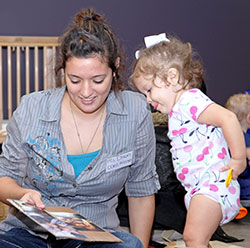 Woman Showing Image to a Toddler