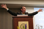 Bill Nye arms raised at stand